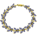 14K. SOLID GOLD BUTTERFLY BRACELET WITH TANZANITES